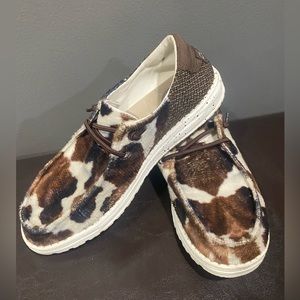 Cow print Hey Dudes size 8 women’s from the Buckle